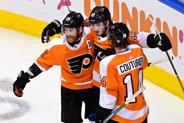 Joel Farabee (center) celebrates after he scored a goal for the second consecutive game, this time the winner as the Flyers took Game 1 of their first-round series against Montreal in Toronto on Wednesday night.