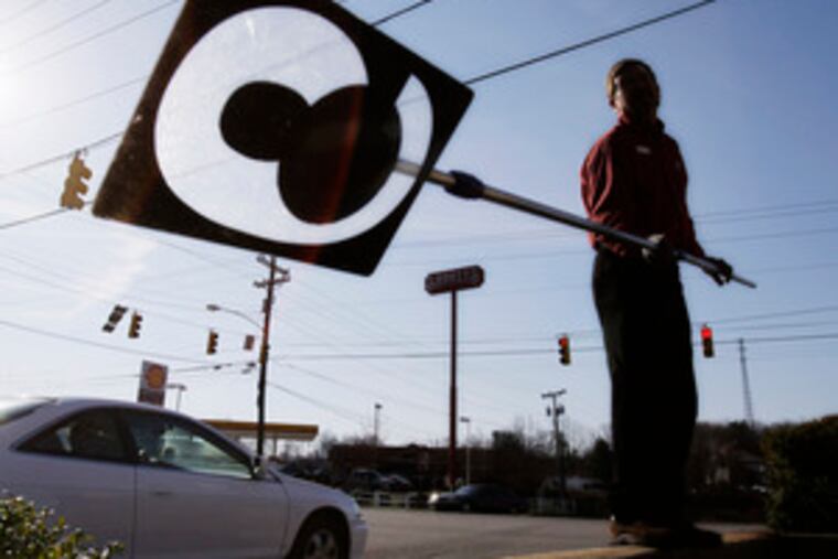 Bruce South, manager of a Citgo in Statesville, N.C., raises the prices at his station for the fourth time in two weeks.