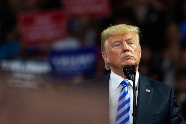 President Trump takes the stage at a rally in support of the Senate candidacy of West Virginia's Attorney General Patrick Morrisey, Tuesday, Aug. 21, 2018, at the Charleston Civic Center in Charleston, W. Va.