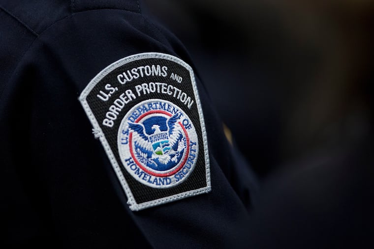 A customs agent wears a patch for the U.S. Customs and Border Protection agency Oct. 27, 2017, at John F. Kennedy International Airport in New York.