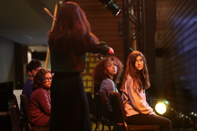 Students from the Special Music School at Kaufman Music Center, NYC, watch violinist Ana Isabella España perform during a live version of the book the students wrote about composer Florence Price at the Kimmel Center on Feb. 3, 2022.