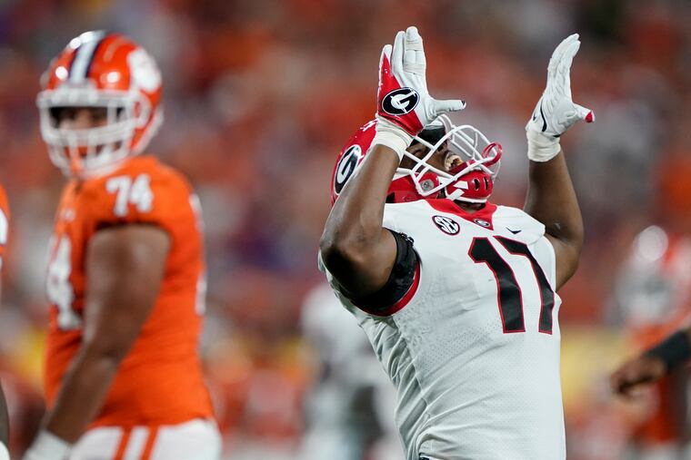 Georgia linebacker Nakobe Dean celebrating after sacking Clemson quarterback D.J. Uiagalelei during the first half Sept. 4, 2021, in Charlotte, N.C.