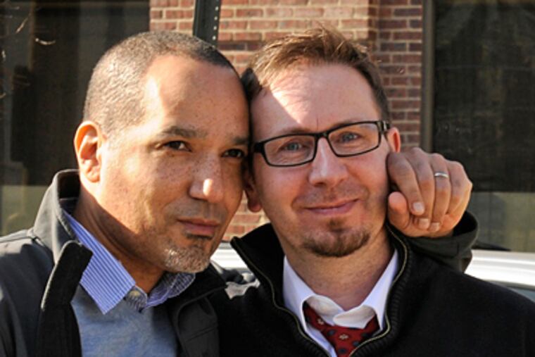 Mark Himes (left) and Frederic Deloizy after meeting with an immigration officer in Philadelphia for a green card. (TOM GRALISH / Staff Photographer)