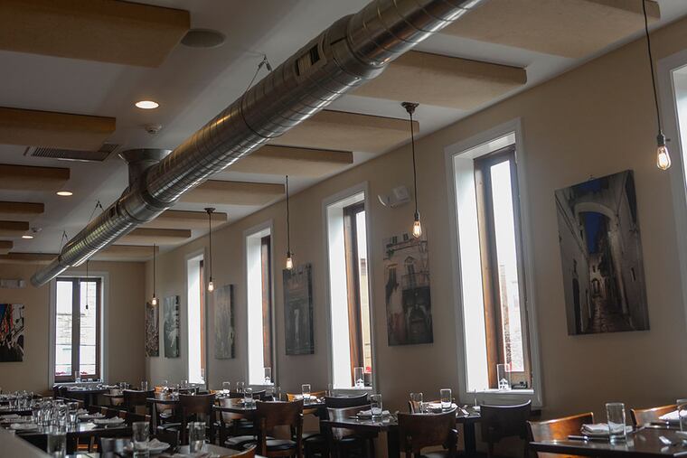 Acoustic panels placed on the ceiling of Brigantessa's second floor absorb noise created during business hours, allowing customers to enjoy their meals in a quiet environment. ( BEN MIKESELL / Staff Photographer )