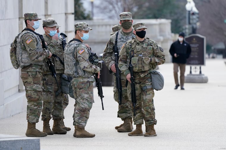 National Guard keep watch on the Capitol on Thursday.