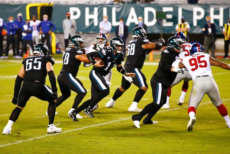 Eagles quarterback Carson Wentz runs with the football against the New York Giants on Oct. 22.
