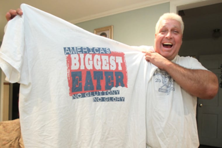 Bill Simmons, known as "El Wingador," plans to move on to other food-related endeavors after his retirement from the wide world of competitive eating. These include a possible reality-TV show. (Charles Fox / Staff Photographer)
