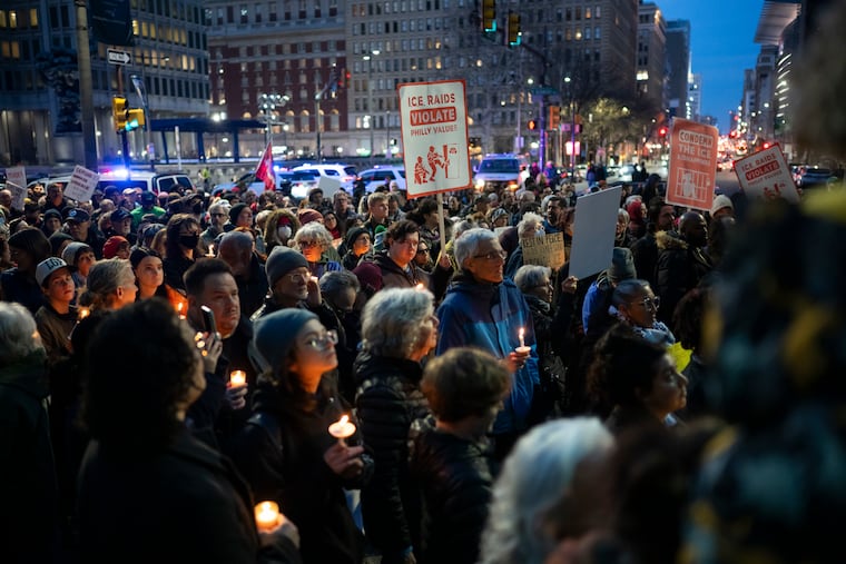 Hundreds of protesters gather for a vigil Thursday at City Hall to rally against the killing of Renee Nicole Good by an ICE agent in Minneapolis.