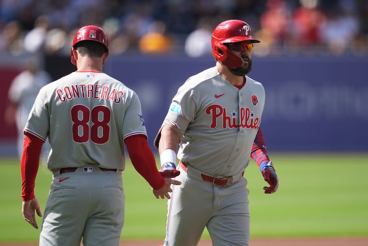 Kyle Schwarber (right) hit his 21st homer of the season at Petco Park on Monday.