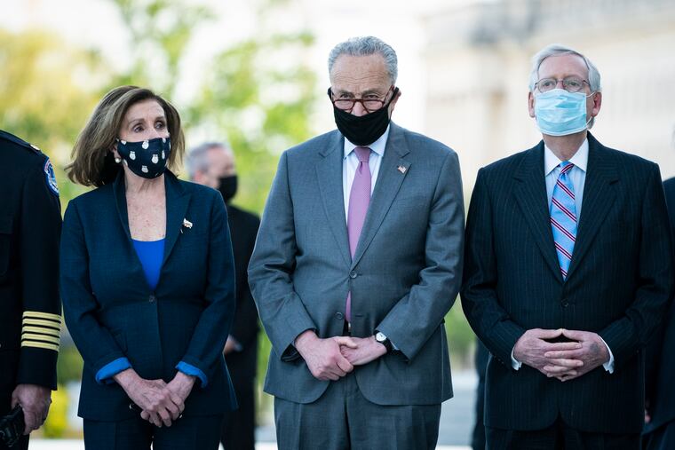 From left, House Speaker Nancy Pelosi of Calif., Senate Majority Leader Chuck Schumer of N.Y., and Senate Minority Leader Mitch McConnell of Ky., wait for the flag-draped casket of U.S. Capitol Police officer William "Billy" Evans, to be carried from the Capitol by a joint services honor guard Washington, Tuesday, April 13, 2021.