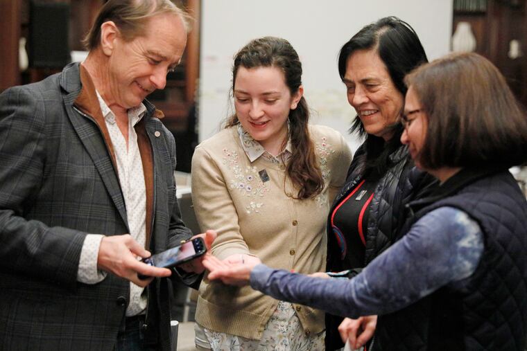 Truth Commissioner Carlos Beristain (left) is presented with paper doves, representing peace, by U.S. delegates Maria Giraldo Gallo, Cristina Espinel and Cristina Escobar at the Hotel Le Méridien on Feb. 21, 2020.