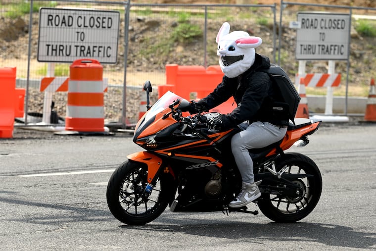 August 14, 2023: Yusuf Sarac rides with his “good bunny” helmet past the Moorestown Mall.