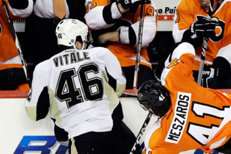 Joe Vitale delivered the hits that knocked Danny Briere and Nick Grossmann out of Sunday's game. (AP Photo/Matt Slocum)