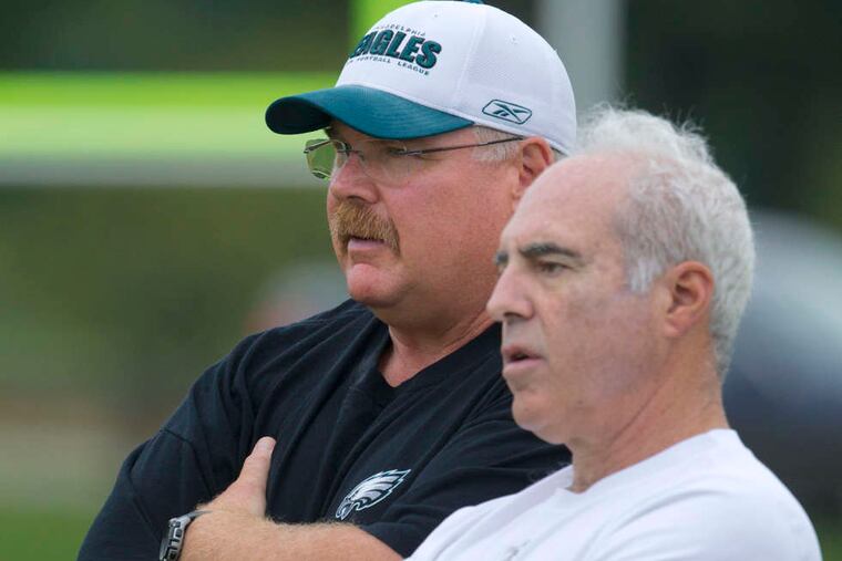 Eagles owner Jeffrey Lurie (right) took a gamble on Andy Reid 21 years ago. It turned out to be one of the best decisions he's ever made.