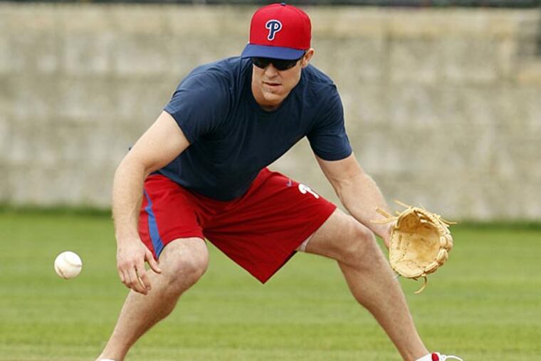 Phillies Chase Utley fields a ground ball during Spring Training workouts in Clearwater, FL on Tuesday, February 12, 2013. (Yong Kim/Staff Photographer)