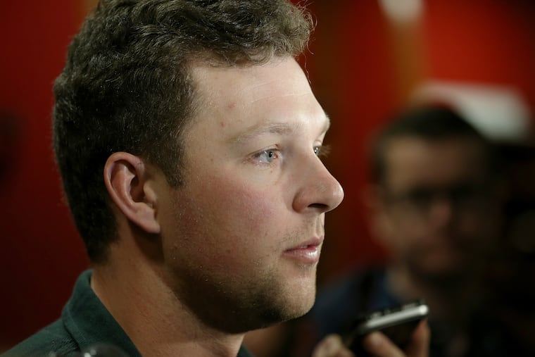 Rhys Hoskins says he has a "gut feeling" that the Phillies will sign either Bryce Harper or Manny Machado.