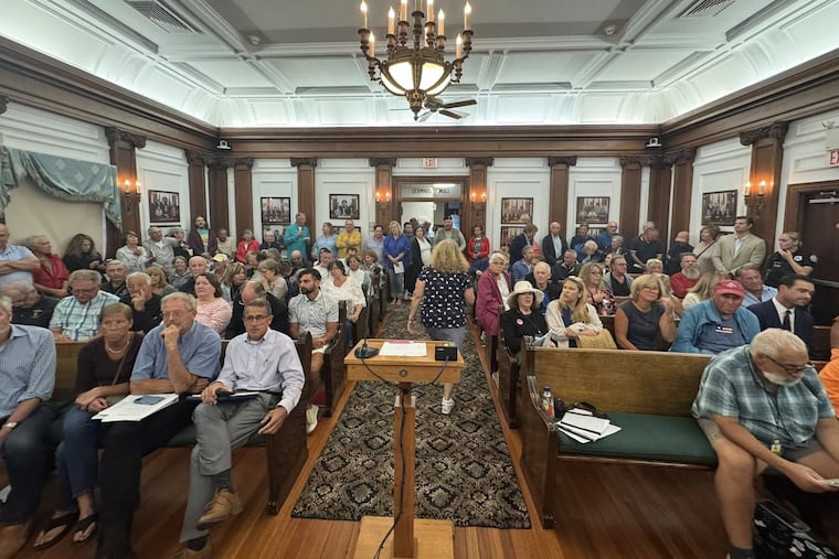Ocean City residents, divided over a developer's plan to build a luxury high-rise hotel on the boardwalk, fill a meeting room in city hall to weigh in Thursday, Aug. 21, 2025.