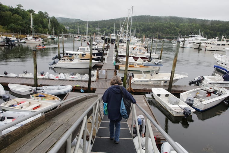 Sharon Daley, director of Maine Seacoast Mission's Island Health Services, walks toward the Sunbeam, the Maine Seacoast Mission's service boat, in Northeast Harbor.