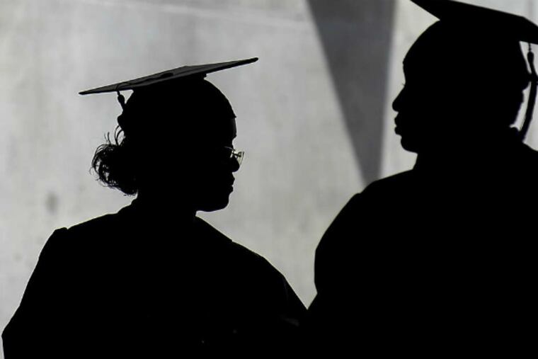 Community College of Philadelphia students wait to receive their degrees in 2007. (File photo)