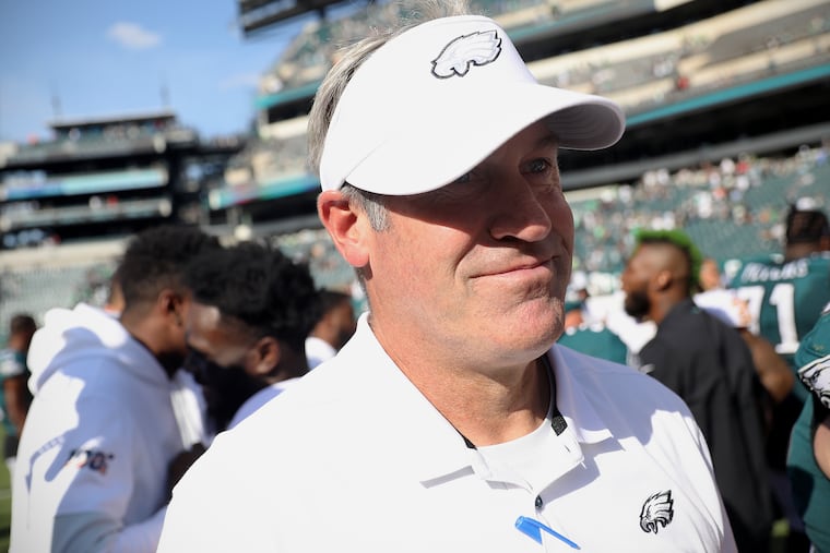 Eagles head coach Doug Pederson smiles as he leaves the field after Sunday's win.