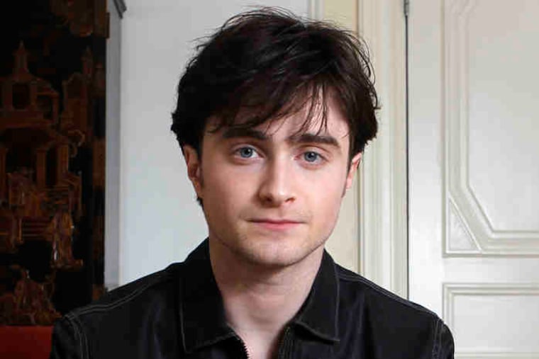 Daniel Radcliffe (left), Emma Watson, with masked actors in London for world premiere (below) and Tom Felton (far left) are working on the final movie of the eight-film saga, set to premiere next July.