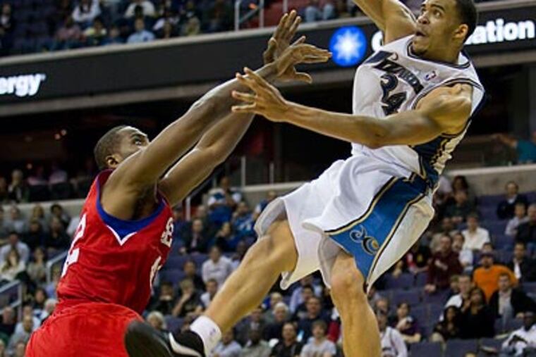 Elton Brand was suspended one game for this flagrant foul on Washington's JaVale McGee. (Evan Vucci/AP)