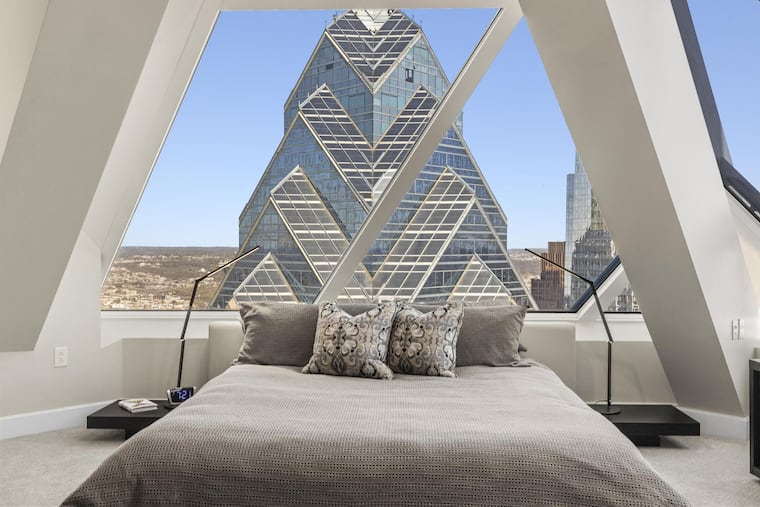 The primary bedroom looks directly at Liberty One. But don't worry about privacy, the Realtor assures. No one can see in.