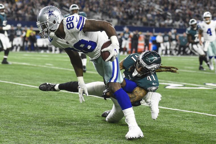Eagles cornerback Ronald Darby tackles Cowboys wide receiver Dez Bryant for a 2-yard gain in the first quarter Sunday night.
