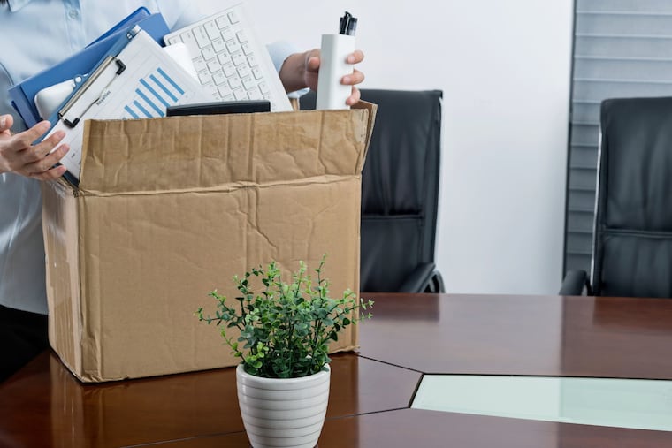 This stock image depicts a person packing up their desk at work after losing their job. Employee terminations should be done with care, or companies could encounter legal problems, Gene Marks writes.