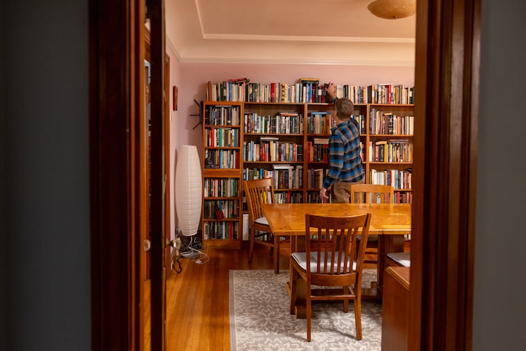 The dining library is a hybrid of an elegant formal dining room and a cozy reading space.