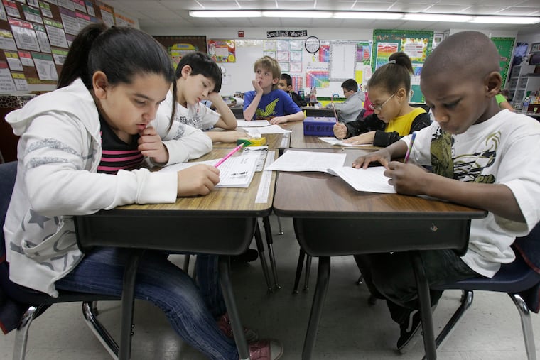 Third-grade students do work during class at an elementary school in Texas. Failure of leadership and conformity to cookie-cutter achievement standards are keeping children from fulfilling their potential, writes Priya E. Mammen.