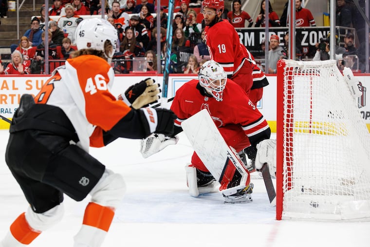 Hurricanes goaltender Brandon Bussi watches the puck go into the net on a goal by the Flyers' Trevor Zegras on Sunday.