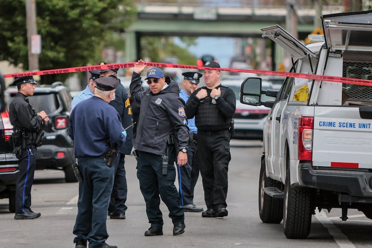 Police officers on the 2200 block of North Camac Street in 2023, where officers had fatally shot Curtis Smith Jr.
