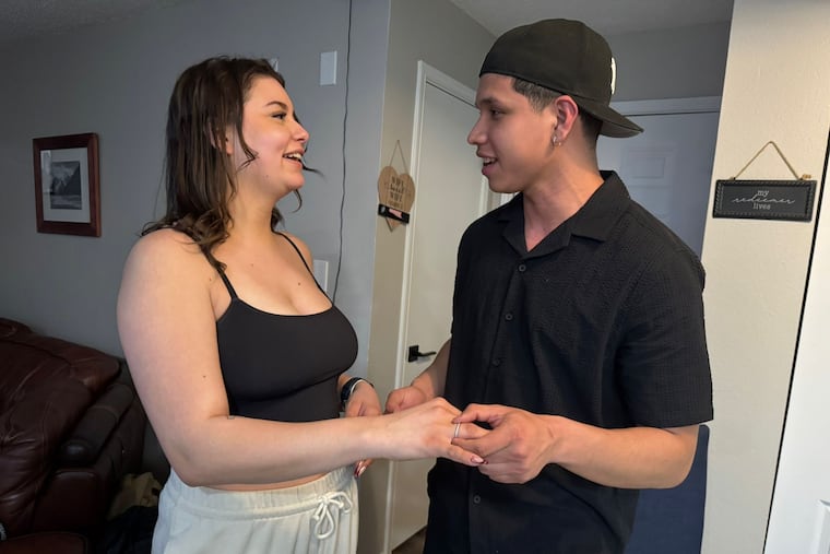 Amanda Souza and Andres Paredes Morales after Morales proposed to Souza in her family home in Norristown.