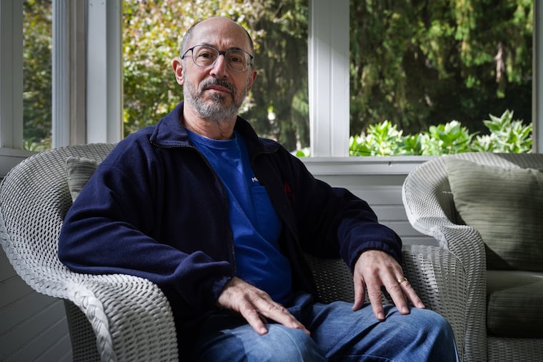 Jay Margolis, 66, shown here at his Radnor home, is partially retired, and has health insurance through his wife's employer. When the couple's premium doubled, they considered whether Jay should switch to Medicare.