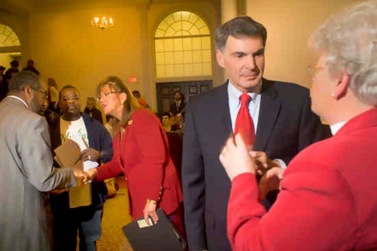 Pa. Supreme Court candidates Jack Panella (front) and Joan Orie Melvin (center) during a debate last week at Temple.