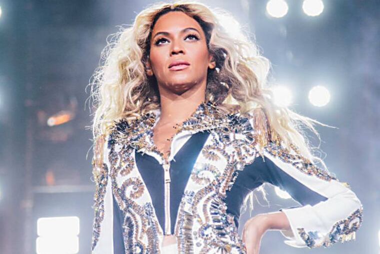 Beyonce performs onstage on her Mrs. Carter World Tour, on Friday, December 20, 2013 at the TD Garden in Boston, Mass. (Photo by Robin Harper/Invision for Parkwood Entertainment/AP)