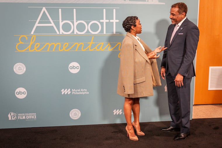 Quinta Brunson, left, and School District of Philadelphia Superintendent Tony Watlington Sr., right, talk at Andrew Hamilton Elementary School in Philadelphia in May.