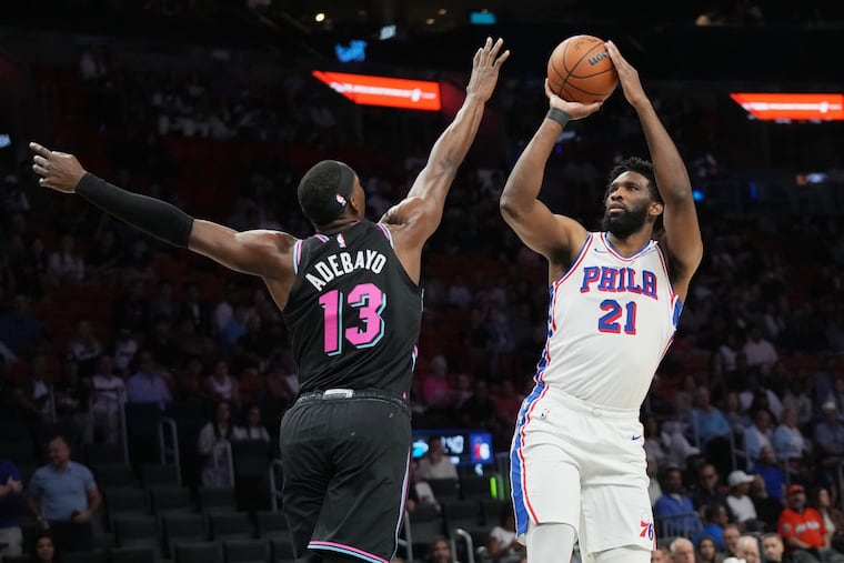 Joel Embiid (right) finished with 26 points on 10-for-25 shooting against Miami.