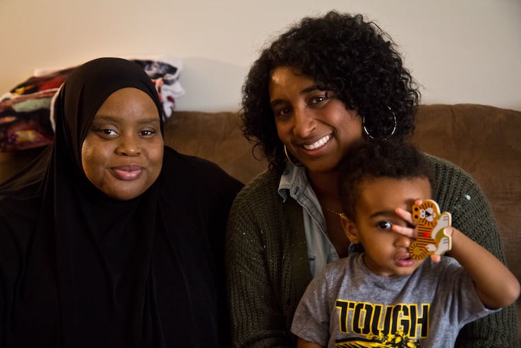 April McNeal, program manager at the Maternity Care Coalition, with Stephanie Lee, and Lee's son Santeno Adams, 2.