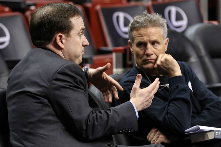 Sixers coach Brett Brown (right) says he'll miss his interactions with Sam Hinkie (left).
