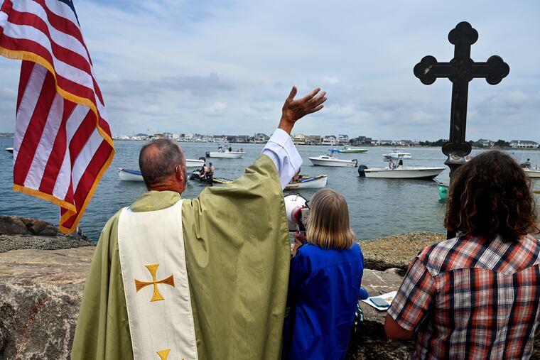 Rev. Henry Hudson during the annual Blessing of the Boats and Bikes at the Church of the Redeemer in Longport July 17, 2022. Houses of worship at the Shore try to woo summer visitors to continue to practice their faith.