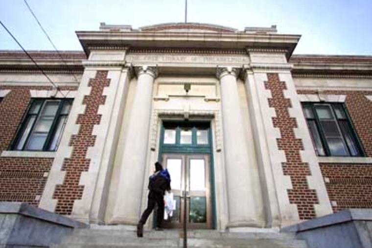 A patron walks into the Kingsessing Library. The Nutter administration announced Wednesday that no Philadelphia public libraries will close before June 30. (David Swanson / Staff Photographer)