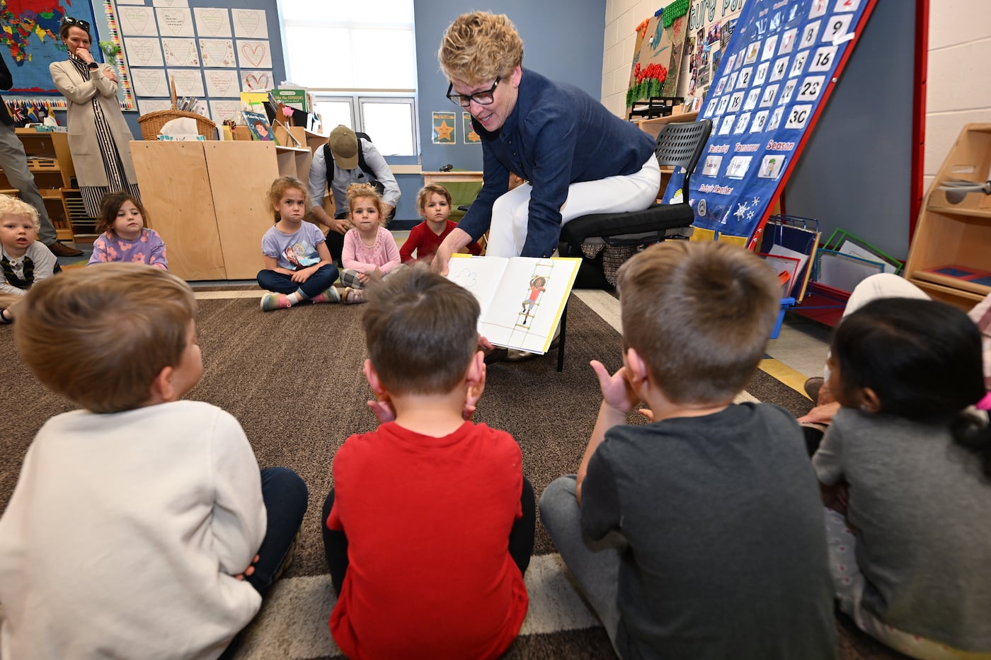 U.S. Rep. Chrissy Houlahan (D., Pa.) interacts with teachers and children at a childcare center at the YMCA in West Chester.