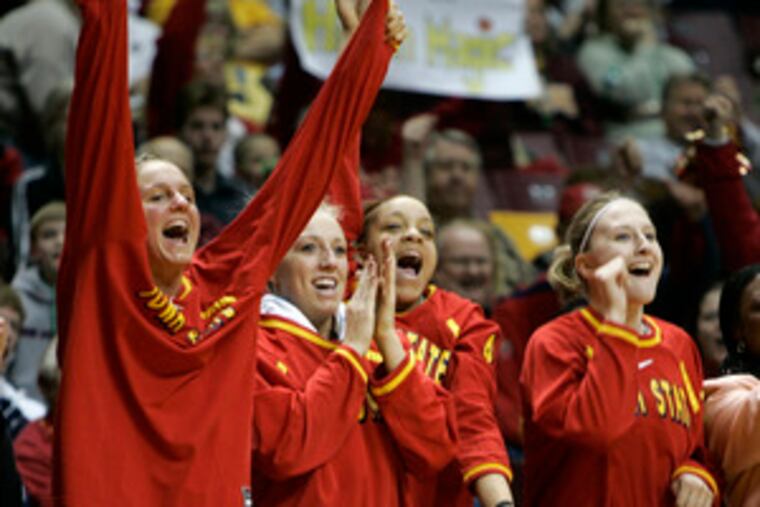 Iowa State players Nicky Wieben (left), Rachel Pierson, Toccara Ross and Amanda Nisleit cheer during their 79-60 win over Washington.