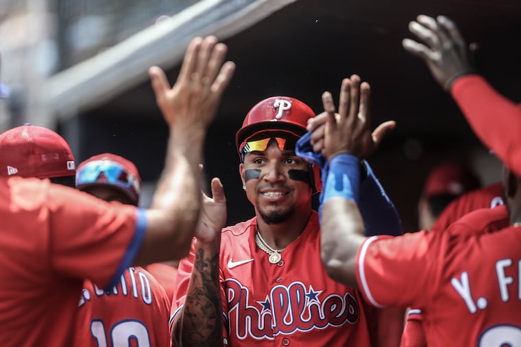 Phillies Johan Camargo celebrates scoring on a Garrett Stubbs sacrifice fly ball against the Yankees during the 4th inning at George M. Steinbrenner Field in Tampa, FL, Monday, April 4, 2022. Yankees beat the Phillies 5-2.