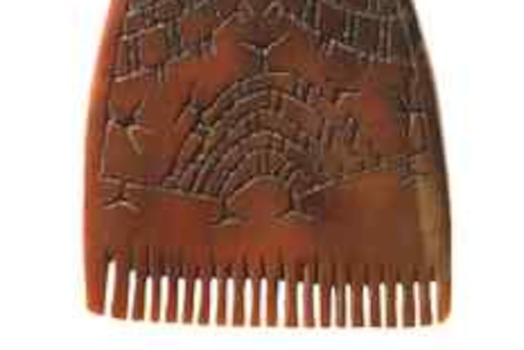 This comb, intricately carved from tusk, is part of an exhibition of Bering Strait ivories at the Princeton University Art Museum.
