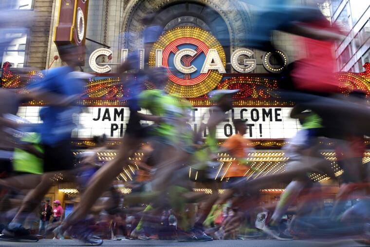Runners participate in the Chicago Marathon, Sunday, Oct. 8, 2017, in Chicago.