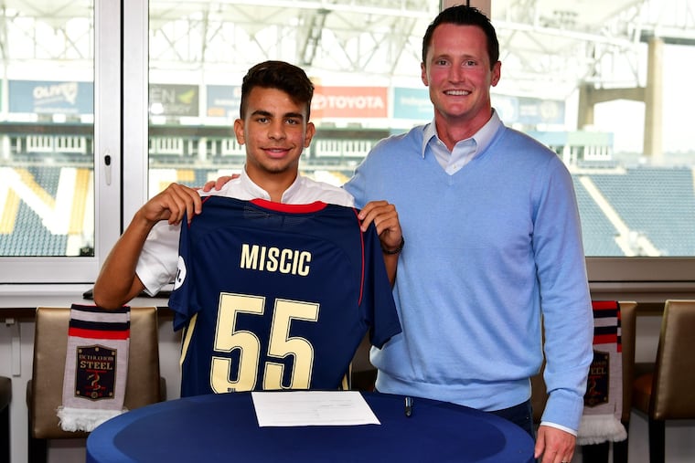 Selmir Miscic (left) with Bethlehem Steel coach Brendan Burke after Miscic, a Philadelphia Union academy product, signed his first professional contract.