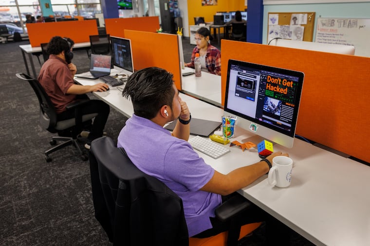 Alex Palillero-Mateo completes work for the web team at Hopeworks in Camden in 2023. Hopeworks helps young people obtain training and experience so they can build long-term careers in technology.